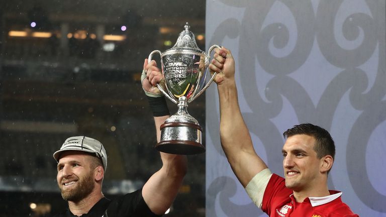 Lions captain Sam Warburton lifts the trophy with All Black's captain Kieran Read after their sides draw the final test 15-15 and tie the series at Eden Park on July 8, 2017