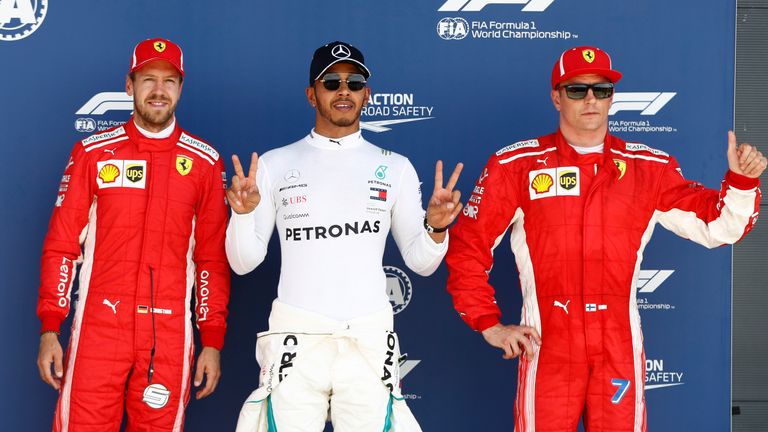 www.sutton-images.com..(L to R): Sebastian Vettel (GER) Ferrari, Lewis Hamilton (GBR) Mercedes-AMG F1 and Kimi Raikkonen (FIN) Ferrari celebrate in parc ferme at Formula One World Championship, Rd10, British Grand Prix, Qualifying, Silverstone, England, Saturday 7 July 2018.