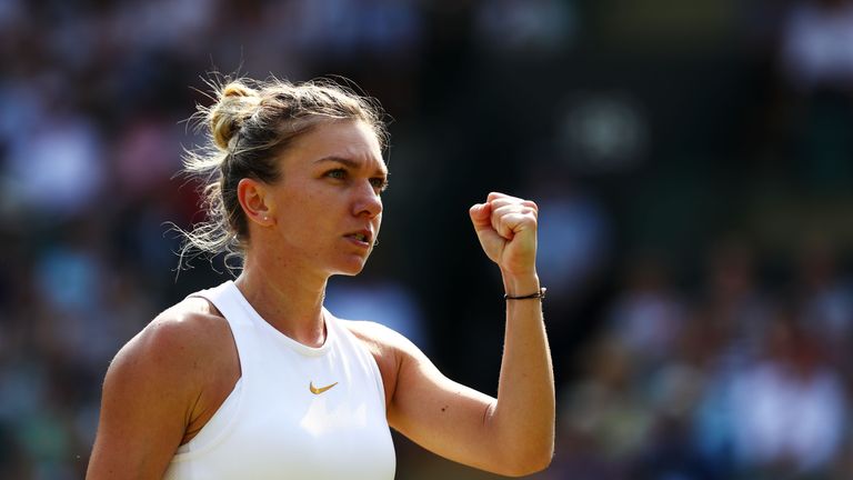 Simona Halep of Romania celebrates after defeating Saisai Zheng of China after their Ladies' Singles second round match on day four of the Wimbledon Lawn Tennis Championships at All England Lawn Tennis and Croquet Club on July 5, 2018 in London, England