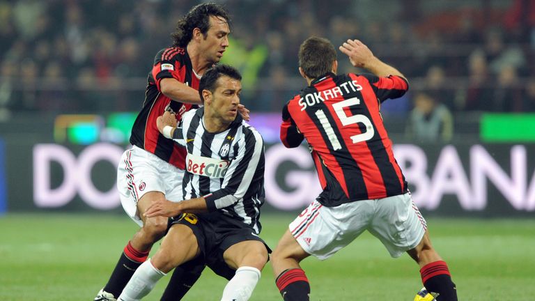 Sokratis Papastathopoulos and Alessandro Nesta in action for Milan in 2010