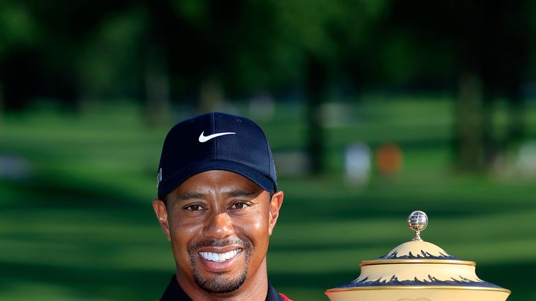 Tiger Woods lifts the Gary Player Cup during the Final Round of the World Golf Championships-Bridgestone Invitational at Firestone Country Club South Course on August 4, 2013 in Akron, Ohio.