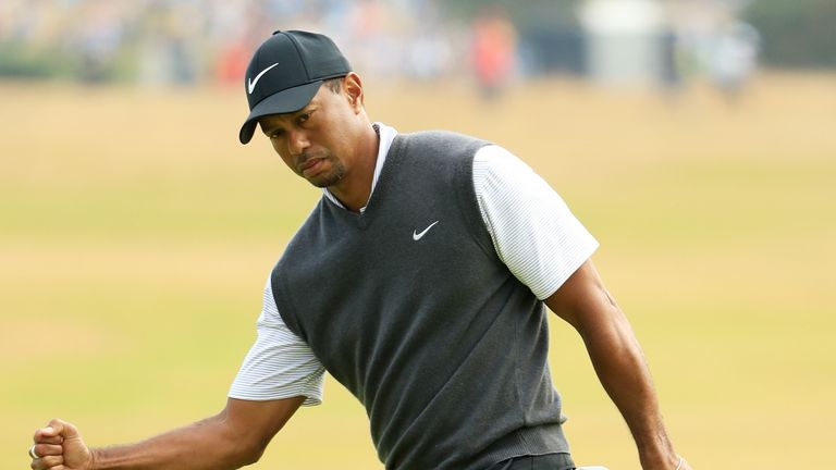 Tiger Woods celebrates making a birdie at The Open