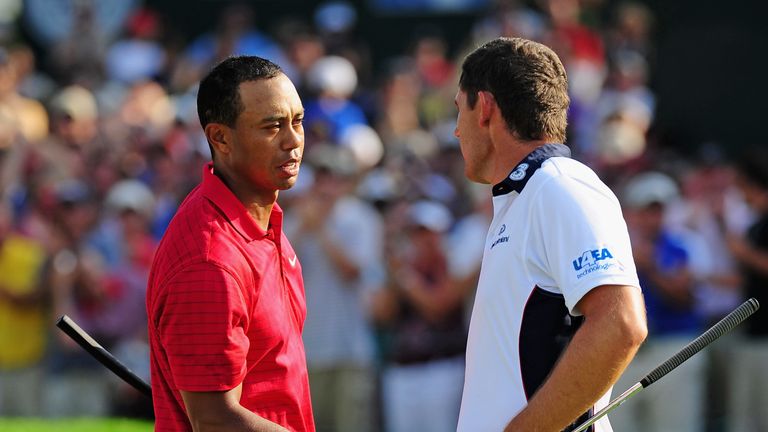 Tiger Woods of USA is congratulated by Padraig Harrington of Ireland on the 18th hole during the final round of the World Golf Championship Bridgestone Invitational on August 9, 2009 at Firestone Country Club in Akron, Ohio.
