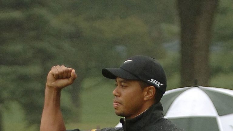 Tiger Woods reacts after sinking his birdie putt to win on the fourth playoff hole during the Bridgestone Invitational at Firestone Country Club August 27, 2006