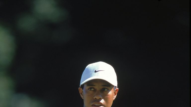 Tiger Woods reacts to his shot during the NEC Invitational World Golf Championships at the Firestone Country Club in Akron