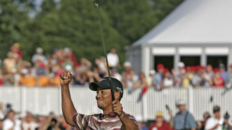 Tiger Woods of the United States celebrates after winning the 2005 NEC Invitational at Firestone Country Club in Akron, Ohio