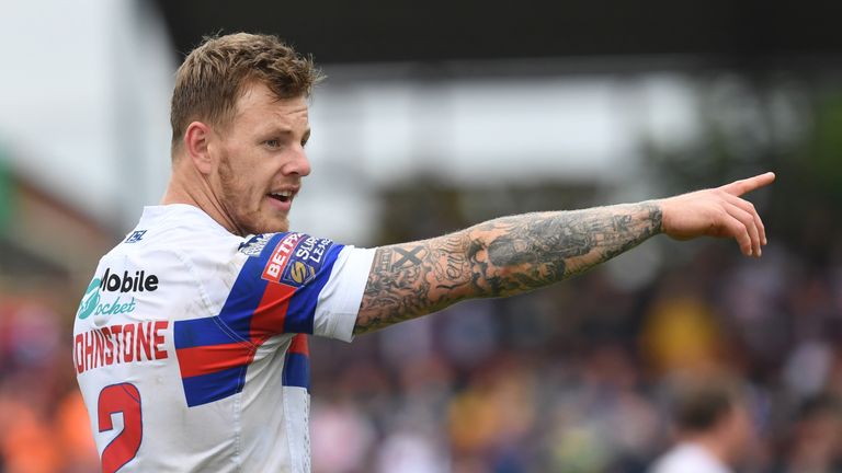 Tom Johnstone scored two tries as Wakefield Trinity shocked Huddersfield 