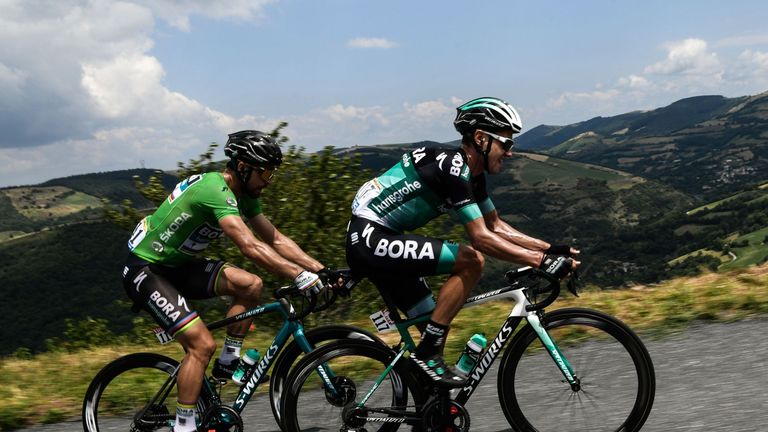 Slovakia's Peter Sagan (L), wearing the best sprinter's green jersey, and Poland's Pawel Poljanski ride during the 15th stage