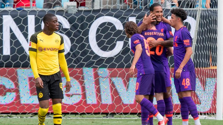 Virgil van Dijk celebrates scoring against Borussia Dortmund 