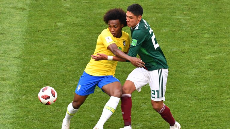 Willian battles for the ball with Edson Alvarez