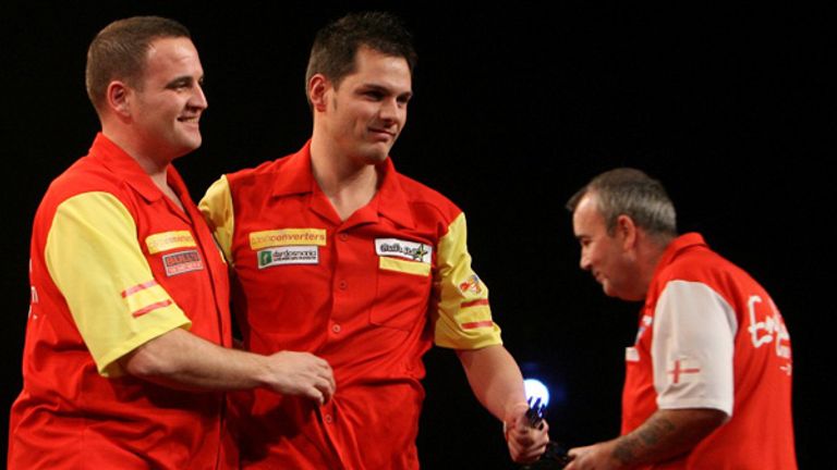 CASH CONVERTERS WORLD CUP OF DARTS.3/12/10.RAINTON MEADOWS ARENA,HOUGHTON-LE-SPRING,CO.DURHAM.ROUND2.ENGLAND V SPAIN.PHIL TAYLOR/JAMES WADE(ENG) V CARLOS RODRIGUEZ/ANTONIO ALCINAS(ESP).SPAINS RODRIGUEZ AND ALCINAS CELEBRATE AS ENGLAND CRASH OUT