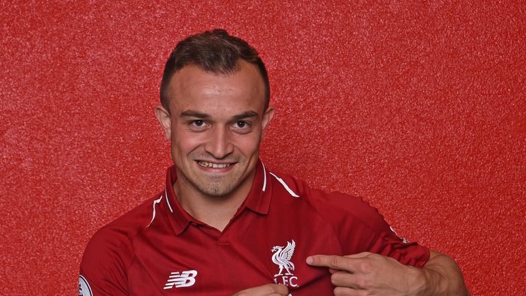 Xherdan Shaqiri signs for Liverpool at Melwood Training Ground on July 13, 2018 in Liverpool, England