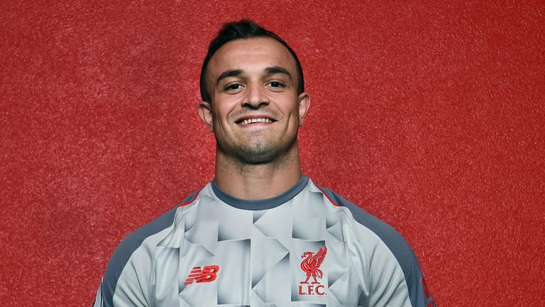 Xherdan Shaqiri in Liverpool&#39;s third kit for the 2018/19 season during his unveiling at the club&#39;s Melwood training ground on July 13, 2018