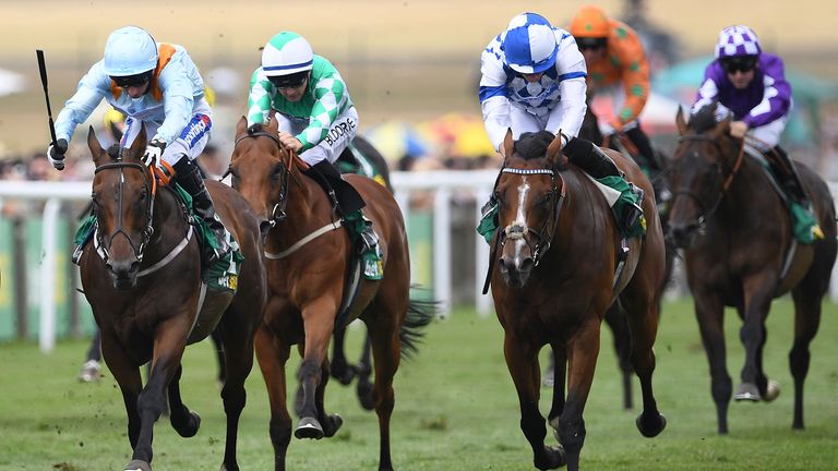 Burnt Sugar ridden by Paul Hanagan (left) wins the bet365 Bunbury Cup Handicap during day three of The Moet & Chandon July Festival at Newmarket Racecourse. PRESS ASSOCIATION Photo. Picture date: Saturday July 14, 2018. See PA story RACING Newmarket. Photo credit should read: Joe Giddens/PA Wire