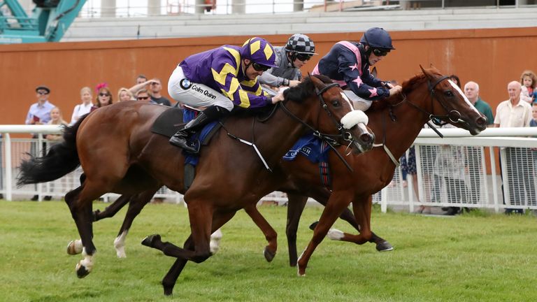 Chocolate Music (left) swoops to score at the Curragh