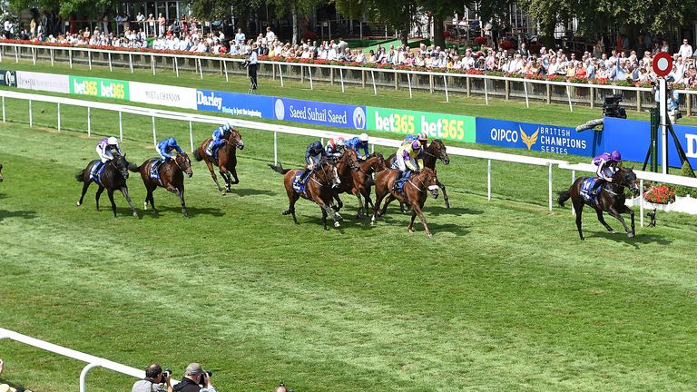 US Navy Flag ridden by Ryan Moore (right) wins the Darley July Cup Stakes during day three of The Moet & Chandon July Festival at Newmarket Racecourse. PRESS ASSOCIATION Photo. Picture date: Saturday July 14, 2018. See PA story RACING Newmarket. Photo credit should read: Joe Giddens/PA Wire