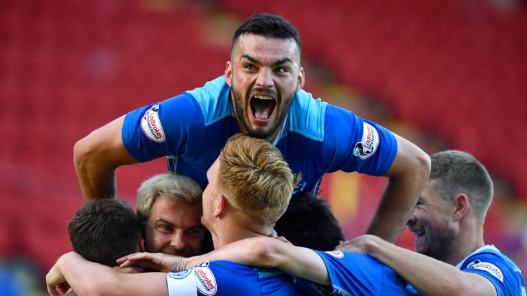 Tony Watt celebrates with his new St Johnstone team mates during a League Cup group stage match