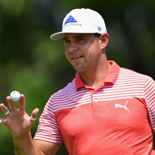 Woodland leads as storms hit PGA