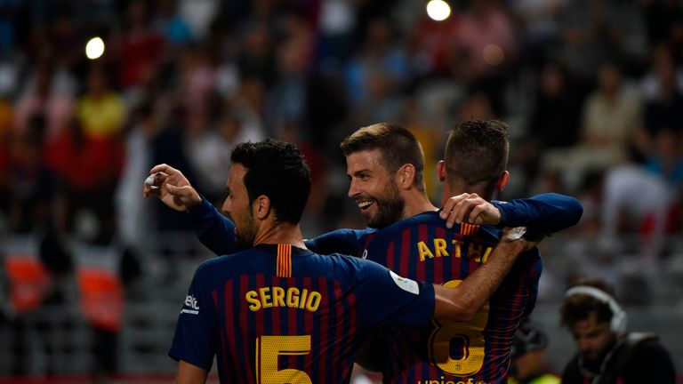 Gerard Pique celebrates after scoring Barcelona's equaliser