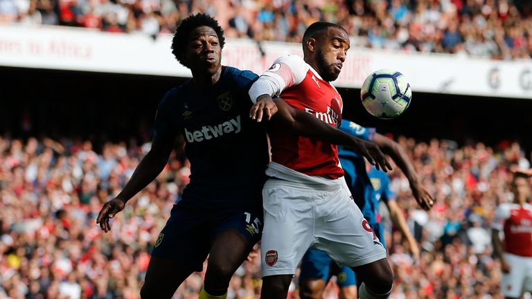 Issa Diop challenges Alexandre Lacazette