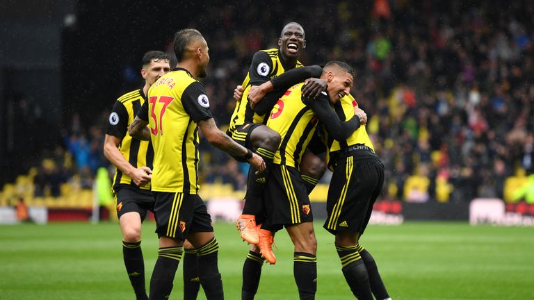 Jose Holebas is mobbed by team-mates after putting Watford 2-0 ahead