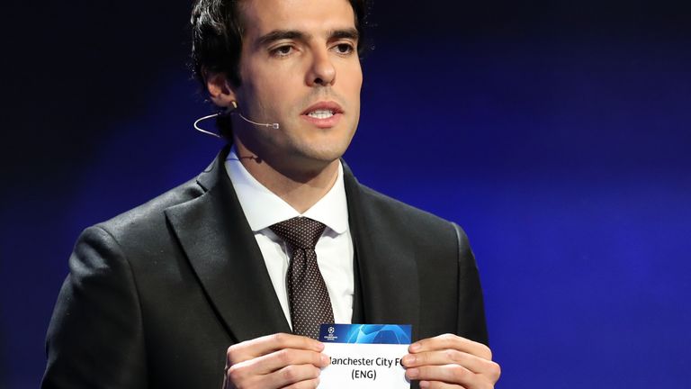 Brazilian former football player Kaka shows the name of Manchester City during the draw for UEFA Champions League football tournament at The Grimaldi Forum in Monaco on August 30, 2018.