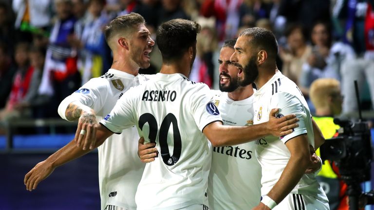 Karim Benzema is congratulated by team-mates after scoring Real Madrid's equaliser