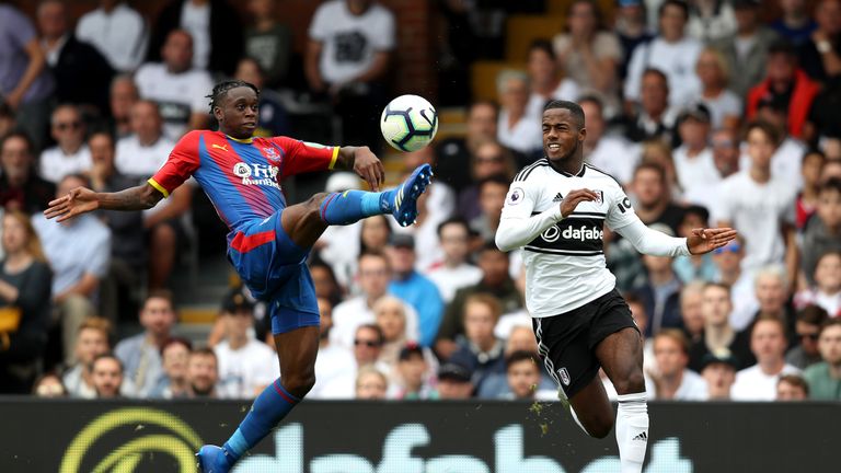 Aaron Wan-Bissaka clears the ball away from Ryan Sessegnon