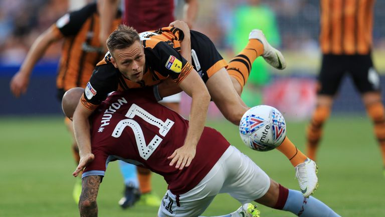 Aston Villa's Alan Hutton and Hull City's Todd Kane battle for the ball during the Sky Bet Championship match at the KCOM Stadium, Hull. PRESS ASSOCIATION Photo. Picture date: Monday August 6, 2018. See PA story SOCCER Hull. Photo credit should read: Mike Egerton/PA Wire. RESTRICTIONS: EDITORIAL USE ONLY No use with unauthorised audio, video, data, fixture lists, club/league logos or "live" services. Online in-match use limited to 75 images, no video emulation. No use in betting, games or single club/league/player publications.