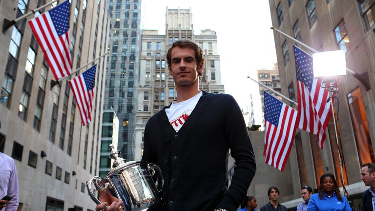 Andy Murray with the US Open Championship trophy following an interview on NBC's Today show during a New York City trophy tour on September 11, 2012