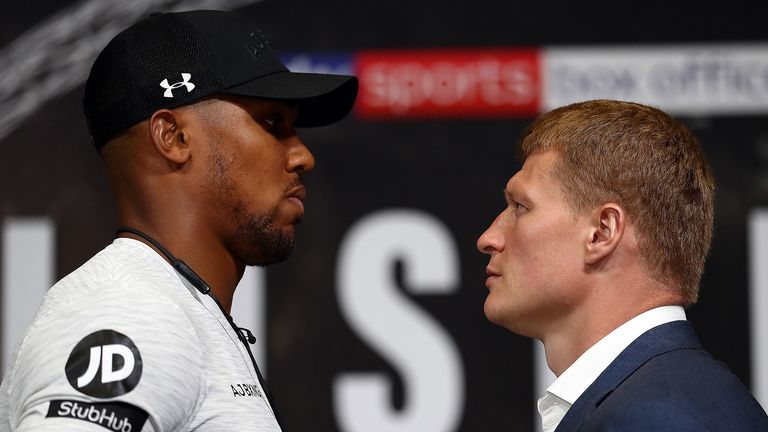 Anthony Joshua (l) goes head to head with Alexander Povetkin during a press conference at Wembley Stadium on July 18, 2018 in London, England.