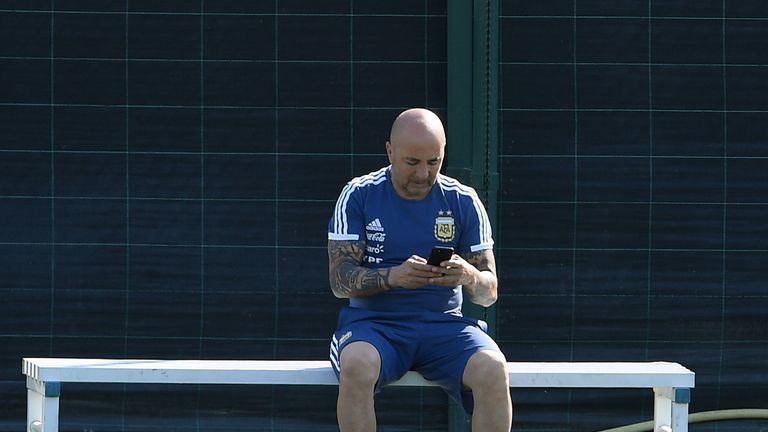 Jorge Sampaoli Argentina manager using mobile phone on touchline at training