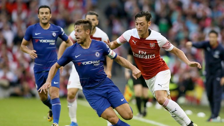 Cesar Azpilicueta chased by Mesut Ozil in Chelsea's friendly with Arsenal