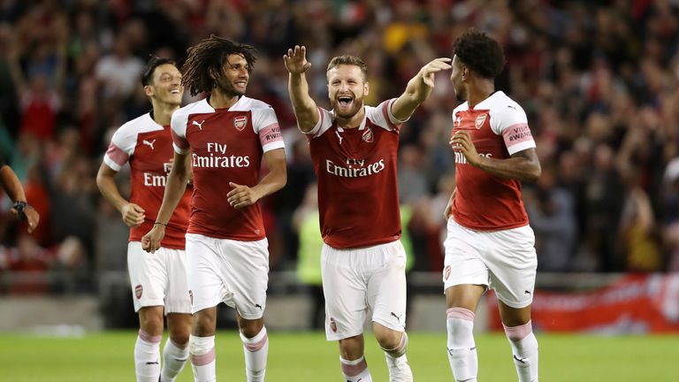 Arsenal players celebrate their penalty shootout win over Chelsea