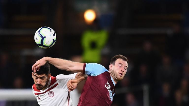 Ashley Barnes and Andreas Bouchalakis challenge for the ball