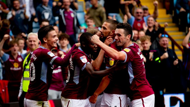Aston Villa players celebrate Birkir Bjarnason's injury-time winner against Wigan at Villa Park