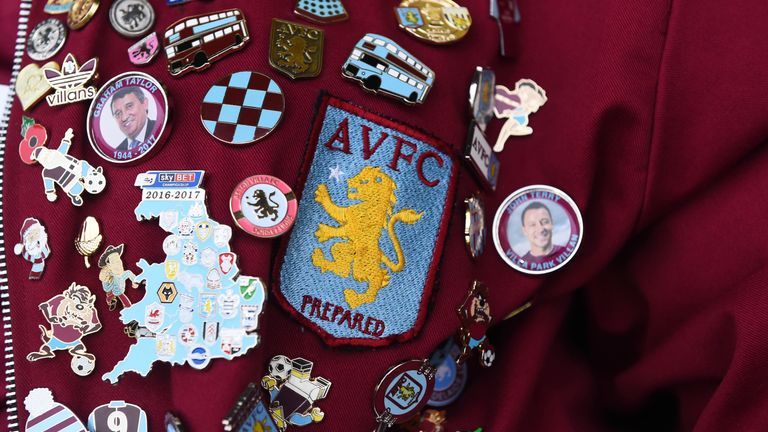 A fan wears Aston Villa badges before the Carabao Cup, Second Round match between Burton Albion and Aston Villa at Pirelli Stadium on August 28, 2018