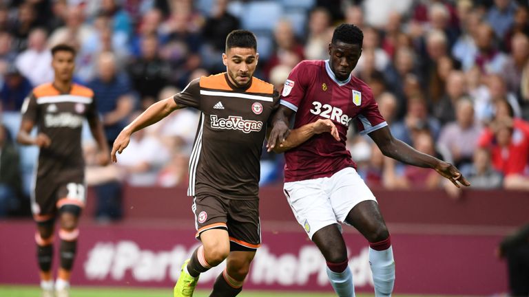 Axel Tuanzebe of Aston Villa battles for possession with Neal Maupay of Brentford during the Sky Bet Championship match between Aston Villa and Brentford at Villa Park on August 22, 2018 in Birmingham, England