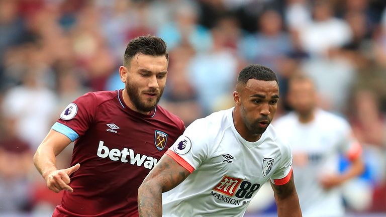 Callum Wilson of AFC Bournemouth is closed down by Robert Snodgrass of West Ham United during the Premier League match between West Ham United and AFC Bournemouth at London Stadium on August 18, 2018 in London, United Kingdom