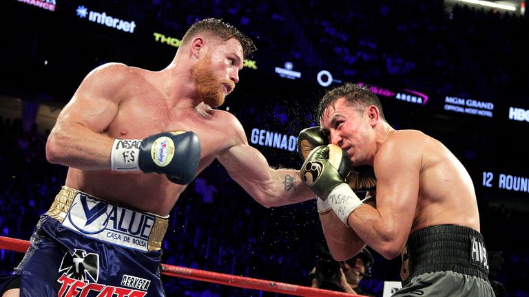 Canelo Alvarez (L) connects with a left hook against Gennady Golovkin (R) during their WBC, WBA and IBF middleweight championship fight at the T-Mobile Arena on September 16, 2017 in Las Vegas, Nevada. .Gennady Golovkin retained his three world middleweight titles