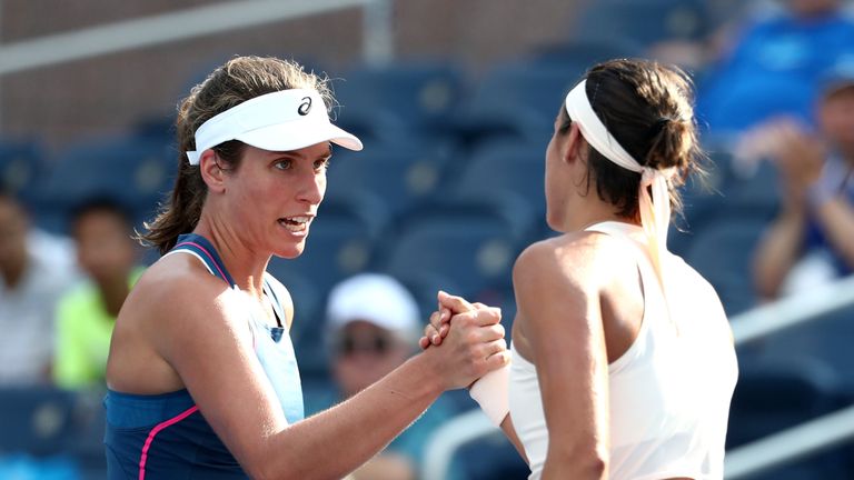 Caroline Garcia of France (R) shakes hands with Johanna Konta of Great Britain on after defeating her in their women's singles first round match on Day Two of the 2018 US Open at the USTA Billie Jean King National Tennis Center on August 28, 2018 in the Flushing neighborhood of the Queens borough of New York City