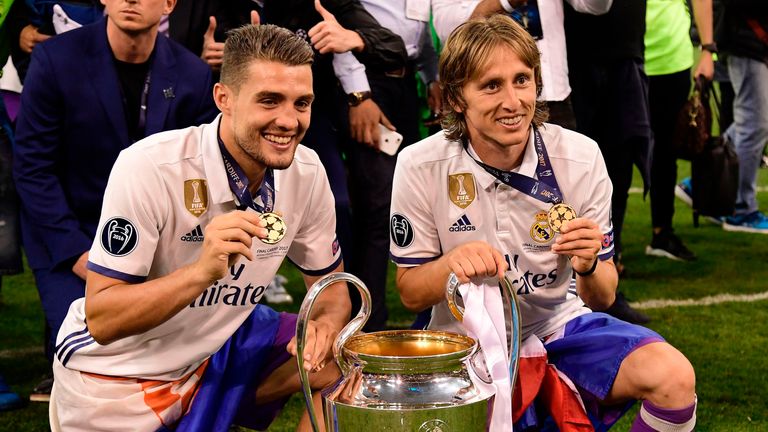 Mateo Kovacic and Luka Modric celebrate with the Champions League trophy in 2017
