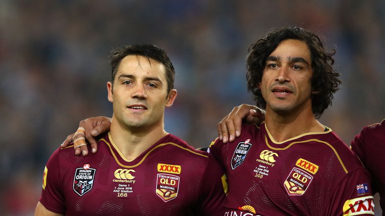 Cooper Cronk of the Maroons and Johnathan Thurston of the Maroons sing the national anthem before game one of the State Of Origin series between the New South Wales Blues and the Queensland Maroons at ANZ Stadium on June 1, 2016 in Sydney, Australia