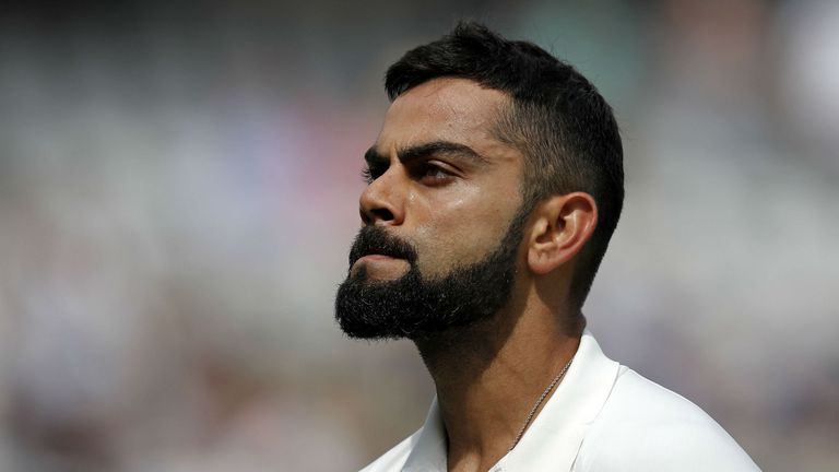 India&#39;s Virat Kohli walks back to the pavilion after losing his wicket for 51 during play on the fourth day of the first Test cricket match between England and India at Edgbaston in Birmingham, central England on August 4, 2018.