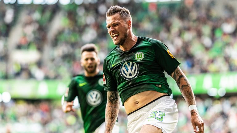 Daniel Ginczek celebrates his late goal for Wolfsburg