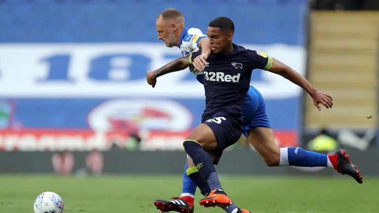 Reading's David Meyler and Derby County's Max Lowe battle for the ball during the Sky Bet Championship match at the Madejski Stadium