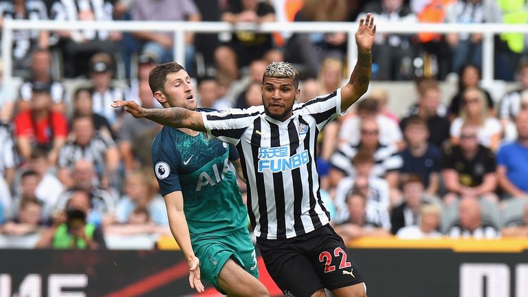 xxxx of Newcastle United is tackled by xxxx of Tottenham Hotspur during the Premier League match between Newcastle United and Tottenham Hotspur at St. James Park on August 11, 2018 in Newcastle upon Tyne, United Kingdom.