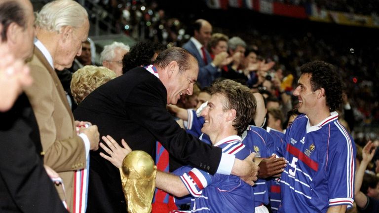 Didier Deschamps goes to collect the World Cup trophy after winning the final for France in 1998