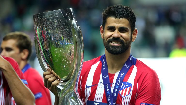 Diego Costa of Atletico Madrid celebrates with the UEFA Super Cup