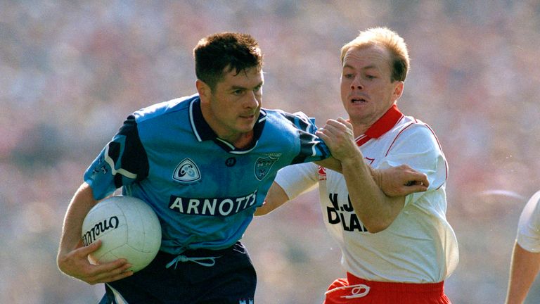 Dublin's Paddy Moran fends off Peter Canavan 